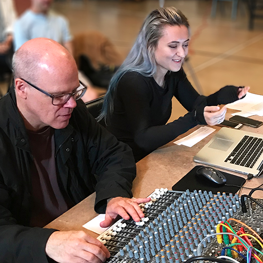 John Gibson and Katherine Bodor prepare for a performance.